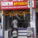 Surya opticians company logo