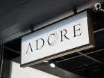 The Adore Company company logo